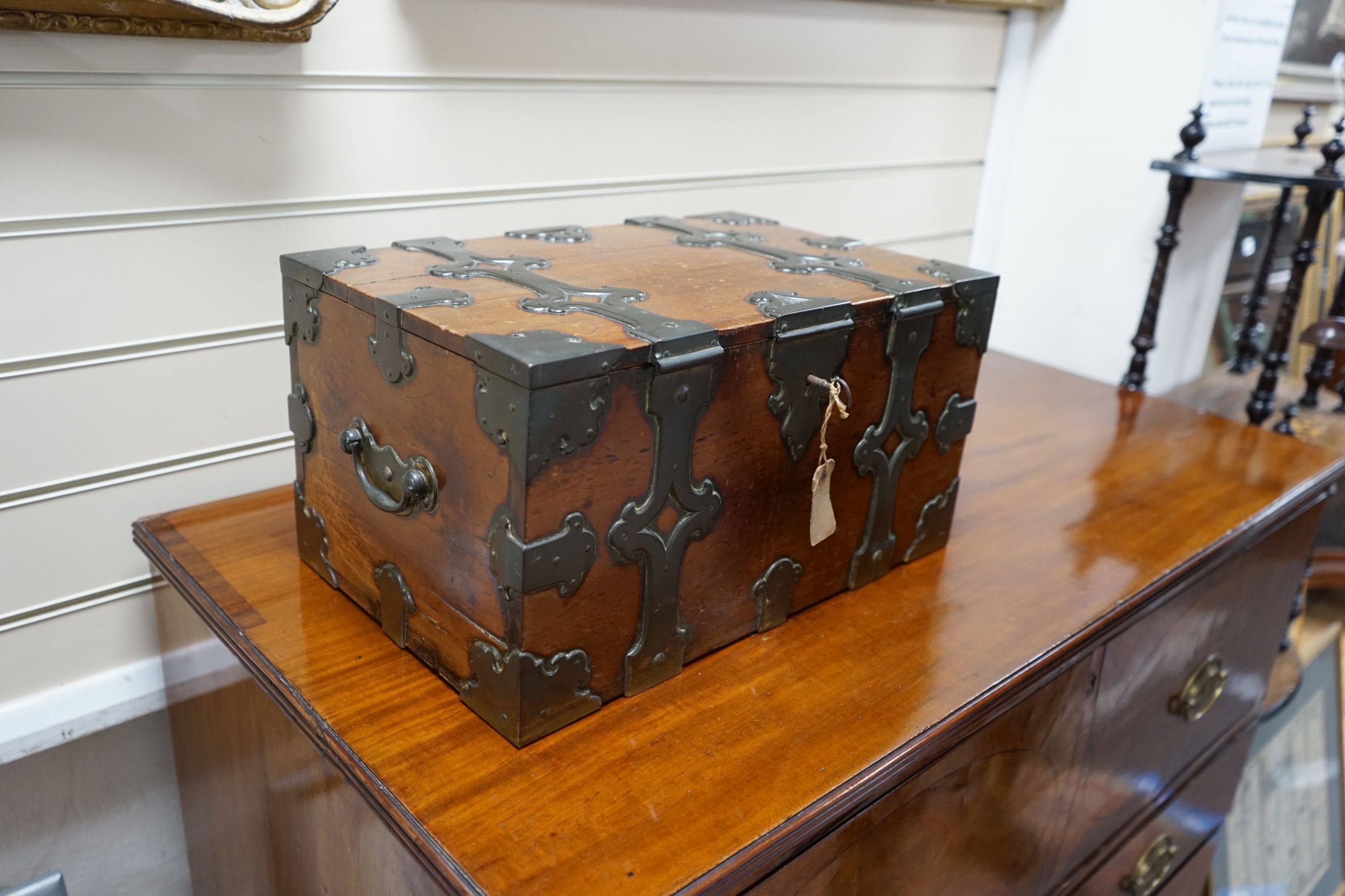 A mid 19th century brass bound stained pine North German Armada chest, with strapwork banding and brass loop handles, width 46cm depth 30cm height 23cm